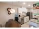 Kitchen with white cabinets, granite countertops, and stainless steel appliances at 5325 Cillette Ave, North Port, FL 34288