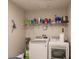 Laundry room with washer, dryer, and shelving for storage at 5325 Cillette Ave, North Port, FL 34288