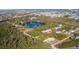 Aerial view of home in a residential neighborhood near a lake at 712 Edmund St, Punta Gorda, FL 33950