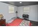 Cozy bedroom with red bedding and wood-look flooring at 712 Edmund St, Punta Gorda, FL 33950