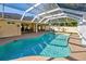 Inviting freeform pool with screened enclosure and ample deck space at 7345 Cameo Cir, North Port, FL 34291