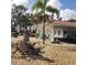Attractive building exterior with festive decor, a tiled roof, decorative rock, and manicured greenery at 806 Hickory Ln, Bradenton, FL 34208