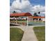 Community shuffleboard courts with seating areas and shade canopies overhead at 806 Hickory Ln, Bradenton, FL 34208