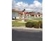 Beautifully landscaped community grounds with a fountain, manicured shrubs, and shuffleboard in the background at 806 Hickory Ln, Bradenton, FL 34208