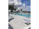 Community pool with several lounge chairs available for use along the pool deck at 806 Hickory Ln, Bradenton, FL 34208