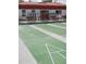 Well-maintained shuffleboard courts with seating, offering a recreational space for residents and guests at 806 Hickory Ln, Bradenton, FL 34208