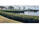 Overlooking lush greenery to a calm body of water, providing a serene and picturesque scene at 806 Hickory Ln, Bradenton, FL 34208
