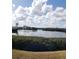 Scenic waterfront view with calm water and trees at 806 Hickory Ln, Bradenton, FL 34208