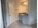Bathroom features a granite vanity with a framed mirror, and a large shower with glass doors at 9159 Melody Cir, Port Charlotte, FL 33981