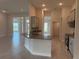 Modern kitchen with granite countertops, gray cabinets, stainless steel appliances, and tile flooring at 9159 Melody Cir, Port Charlotte, FL 33981
