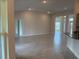 Spacious living room with tile flooring and ample natural light, ideal for relaxation and entertaining at 9159 Melody Cir, Port Charlotte, FL 33981