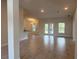 Open-concept living area featuring tile floors, recessed lighting, and access to outdoor patio at 9159 Melody Cir, Port Charlotte, FL 33981
