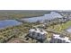 Aerial view of community, highlighting building and waterfront location at 10055 Links Ln # 306, Rotonda West, FL 33947