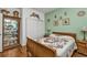 Second bedroom with wood floors and built in shelving at 10055 Links Ln # 306, Rotonda West, FL 33947