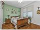 Charming bedroom with light walls, wooden floors, and a tranquil atmosphere at 10055 Links Ln # 306, Rotonda West, FL 33947