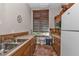 Community kitchen with stainless steel appliances and wood cabinets at 10055 Links Ln # 306, Rotonda West, FL 33947