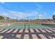 Relaxing community pool with brick patio and water views at 10055 Links Ln # 306, Rotonda West, FL 33947
