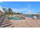 Community pool area with pergola and lounge chairs at 10055 Links Ln # 306, Rotonda West, FL 33947