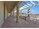 Covered patio walkway with seating and pool views at 10055 Links Ln # 306, Rotonda West, FL 33947