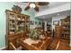 Quaint dining room with a wooden table, hutch, and hardwood floors at 10055 Links Ln # 306, Rotonda West, FL 33947