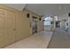 Interior hallway with elevator and access to condo units at 10055 Links Ln # 306, Rotonda West, FL 33947