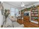 Comfortable living room with built-in shelving and hardwood floors at 10055 Links Ln # 306, Rotonda West, FL 33947