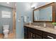 Bathroom with single vanity, granite countertop, and shower/tub combo at 1330 Appian Dr, Punta Gorda, FL 33950
