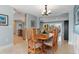 Charming dining room with wooden table and chairs, offering views to the living room and kitchen at 1330 Appian Dr, Punta Gorda, FL 33950
