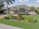 Attractive single-story home with landscaped yard, a large driveway and a three-car garage at 1330 Appian Dr, Punta Gorda, FL 33950