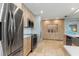 Modern kitchen with stainless steel appliances and light wood cabinets at 1330 Appian Dr, Punta Gorda, FL 33950