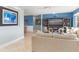 Light and airy living room features a large TV, comfortable seating and access to dining area at 1330 Appian Dr, Punta Gorda, FL 33950