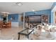 Spacious living room with large TV, comfortable seating and views into dining and kitchen areas at 1330 Appian Dr, Punta Gorda, FL 33950