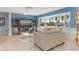 Bright living room with bay window, offering water views, comfy seating, and built-in shelving at 1330 Appian Dr, Punta Gorda, FL 33950