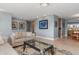 Living area with light walls, comfortable seating, and a glass-top coffee table at 1330 Appian Dr, Punta Gorda, FL 33950
