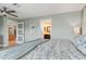 Main bedroom with king-size bed and access to bathroom at 1330 Appian Dr, Punta Gorda, FL 33950