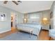 Spacious main bedroom with king bed and en-suite bathroom at 1330 Appian Dr, Punta Gorda, FL 33950