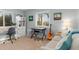 Home office featuring a built-in desk, comfortable seating and large windows at 1330 Appian Dr, Punta Gorda, FL 33950