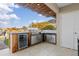 Outdoor kitchen with grill, fridge, and ample counter space at 1330 Appian Dr, Punta Gorda, FL 33950