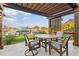 Relaxing patio with pergola, seating, and water view at 1330 Appian Dr, Punta Gorda, FL 33950