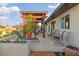 Relaxing patio with pergola, lounge chairs, and planters at 1330 Appian Dr, Punta Gorda, FL 33950
