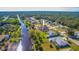 Aerial view of canal-front property with spacious lot and surrounding homes at 158 Eppinger Dr, Port Charlotte, FL 33953
