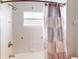 Bathroom with shower/tub combo and patterned shower curtain at 158 Eppinger Dr, Port Charlotte, FL 33953