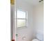 Clean and bright secondary bathroom with toilet and window at 158 Eppinger Dr, Port Charlotte, FL 33953