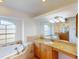 Elegant bathroom featuring a large soaking tub and granite vanity at 158 Eppinger Dr, Port Charlotte, FL 33953