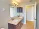 Bathroom with double vanity, granite countertop, and built-in cabinets at 158 Eppinger Dr, Port Charlotte, FL 33953