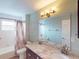 Bathroom with double vanity, granite countertop, and a shower/tub combo at 158 Eppinger Dr, Port Charlotte, FL 33953