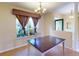 Formal dining room with window and decorative curtain at 158 Eppinger Dr, Port Charlotte, FL 33953