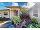 House exterior featuring a covered entryway, landscaping, and a large garage at 158 Eppinger Dr, Port Charlotte, FL 33953