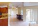 Kitchen with granite counters, breakfast nook, and access to backyard patio at 158 Eppinger Dr, Port Charlotte, FL 33953