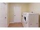 Laundry room with washer, dryer, and extra storage at 158 Eppinger Dr, Port Charlotte, FL 33953
